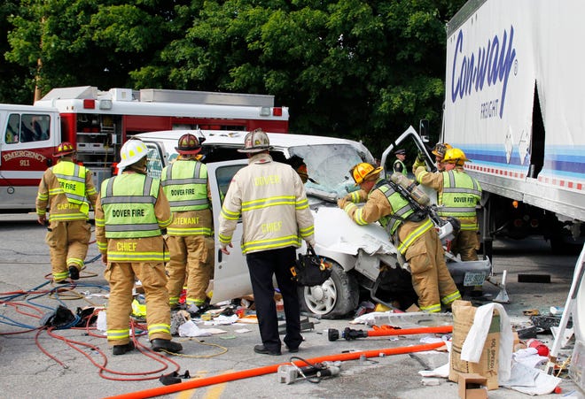 Firefighters work to extricate the driver of a van who collided with a tractor trailer truck at the intersection of Littleworth Road and Crosby Road Thursday afternoon in Dover. Photo by Shawn St.Hilaire/Fosters.com