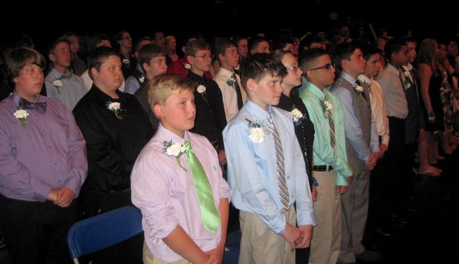 Seventy-nine students waited on the stage at Winnacunnet High School's auditorium during the start of their eighth-grade graduation ceremony Tuesday. Photo by Kiki Evans/Seacoastonline