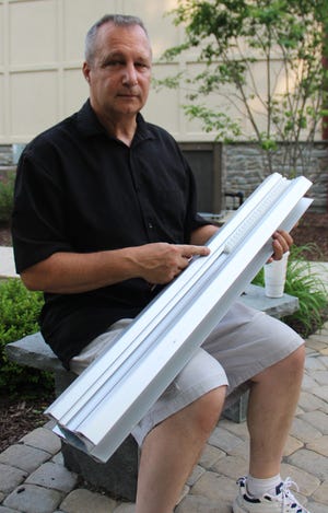 David Willson, certified specialist and owner of Aging Comfortably at Home LLC, shows a section of a stairlift with greaseless moving parts. He tries to get materials made in the U.S.

JESSICA COHEN/For the Pocono Record