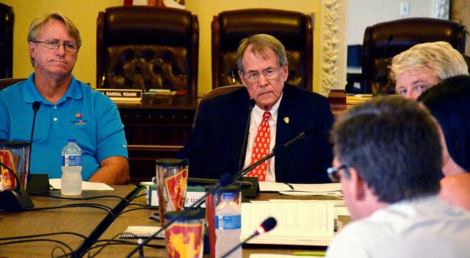PETER.WILLOTT@STAUGUSTINE.COM St. Augustine City Manager John Regan and Flagler College President William Abare listen as the Flagler College Town and Gown Task Force present their findings on how to improve relations between the college and city residents during a meeting on Wednesday, June 17, 2015. The meeting was held in the Alcazar Room in the Lightner Building in St. Augustine.