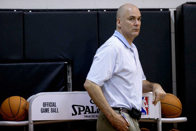 Atlanta Hawks general manager Danny Ferry watches the NBA basketball team's practice Tuesday, July 10, 2012, in Atlanta.