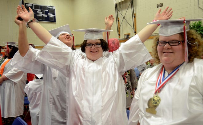 Graduates from the Special Services School District of Burlington County raise their arms after the conclusion of their graduation, Friday, June 19, 2015 at the Westampton campus.