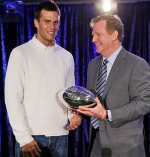 FILE - In this Feb. 2, 2015, file photo, New England Patriots quarterback Tom Brady poses with NFL Commissioner Rodger Goodell during a news conference after NFL football's Super Bowl XLIX in Phoenix, Ariz. Brady grew from a sixth-round draft choice into one of the best quarterbacks in NFL history. On Tuesday, NFL commissioner Roger Goodell hears Brady's appeal of a four-game suspension for using deflated footballs in the AFC championship game. How will that affect Brady's legacy? (AP Photo/David J. Phillip, File)