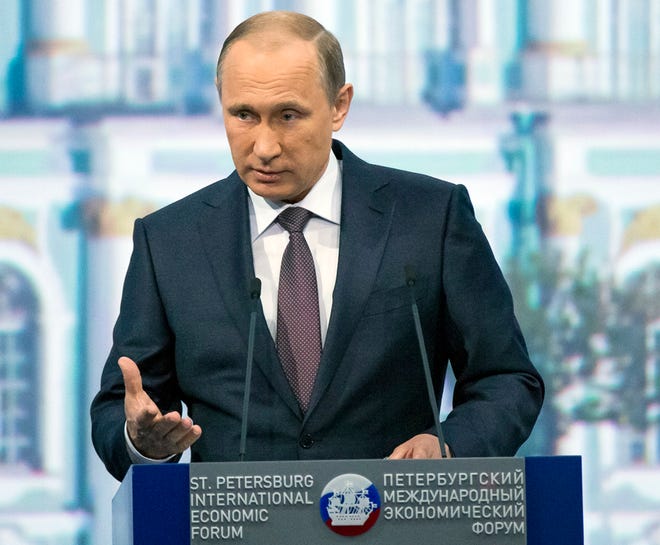 Russian President Vladimir Putin speaks during a plenary session of the St. Petersburg International Investment Forum in St.Petersburg, Russia on Friday.