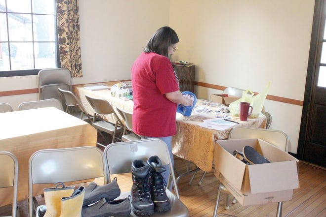 Sue Carter organizes items for troops overseas.