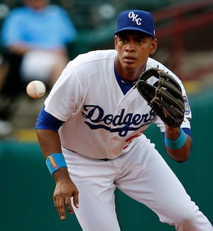 Hector Olivera of the Oklahoma City Dodgers fields a ball in the second of a baseball game against the Memphis Redbirds at the Chickasaw Bricktown Ballpark in Oklahoma City, Thursday, June 18, 2015. Photo by Bryan Terry, The Oklahoman