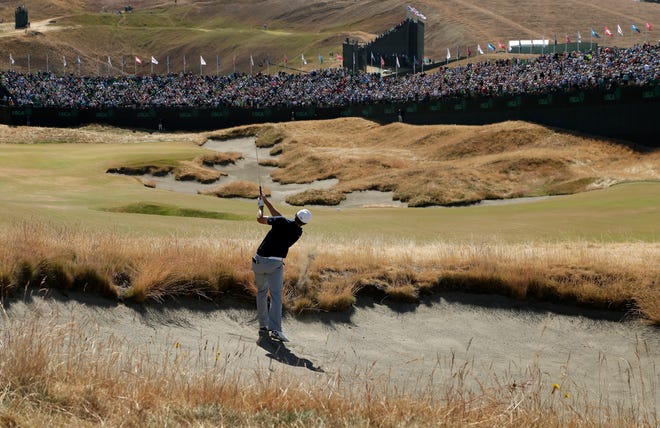 Jordan Spieth hits out of a bunker on the 18th hole during the second round of the U.S. Open Friday at Chambers Bay. AP Photo