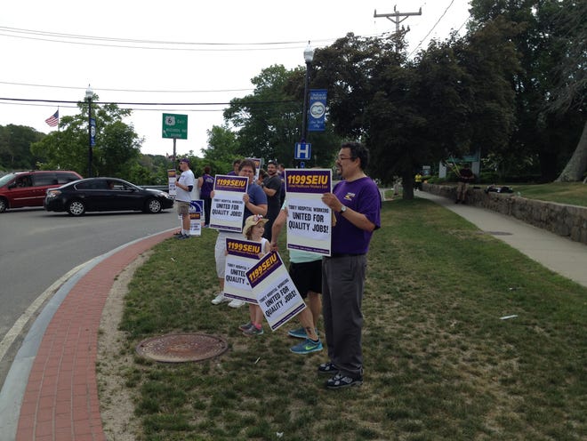 Protesters picket Friday afternoon outside Tobey Hospital in support of service employees. SANDY QUADROS BOWLES/THE STANDARD-TIMES