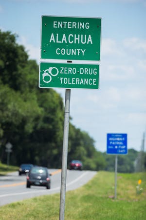 County considers removing "Zero Drug Tolerance" signs.