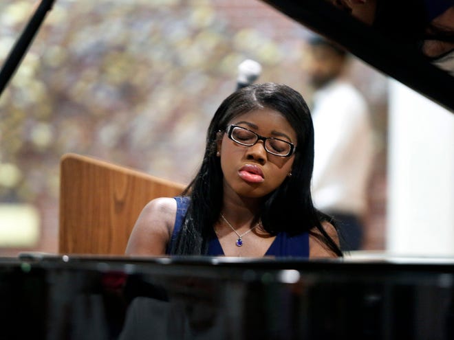 Local pianist Bailey-Michelle Collins performs Friday during the 2015 University of Florida International Piano Festival Participant Recital, presented by the UF School of Music at UF Health Shands Hospital in Gainesville.