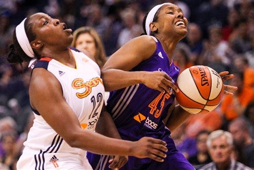 Phoenix Mercury's Noelle Quinn (45) drives against Connecticut Sun's Chelsea Gray (12) during a WNBA basketball game in Phoenix, Ariz., Friday, June 19, 2015. (Isaac Hale/The Arizona Republic via AP)  MARICOPA COUNTY OUT; MAGS OUT; NO SALES; MANDATORY CREDIT