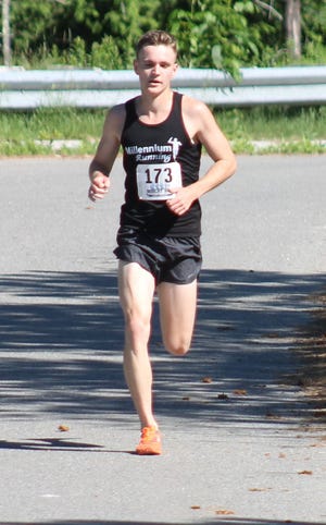 Durham's Aliaksandr Leuchanka won the Bobcat Bolt 5K road race for the second year in a row Saturday in Durham. AL PIKE/FOSTERS.COM