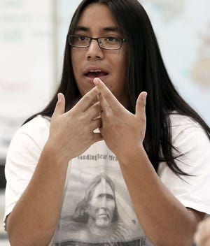 Madison West High School junior Gabriel Saiz, a member of the Ponca Tribe of Nebraska, participates in a discussion on Monday, June 1, 2015 in Madison, Wis.  The students, and several other members of the school's Native American Student Association, are in favor of a recent school board decision which bans the wearing of any clothing that features Indian logos and mascots used by sports teams. JOHN HART/WISCONSIN STATE JOURNAL