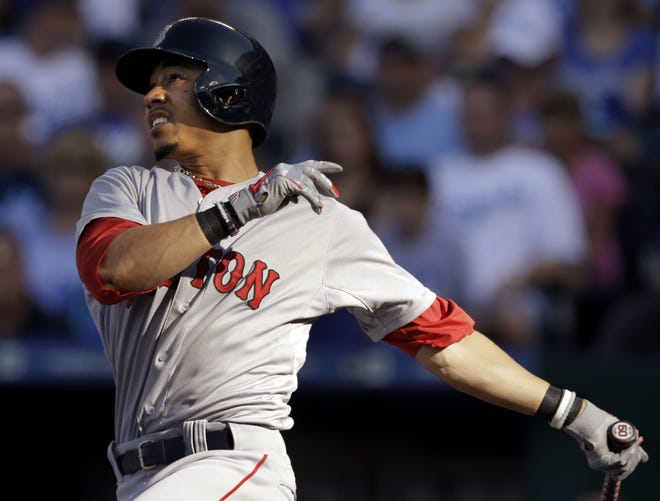 Boston's Mookie Betts hits a solo homer during the first inning of Saturday's game. The Associated Press