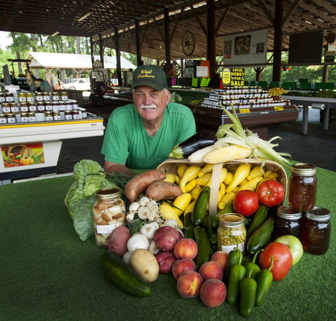Tommy West, owner of West Produce on Hayes Road in Harnett County, just north of Spring Lake, shows off some the fresh produce he grows on his family-owned farm on June 10, 2015.  His farm dates back 121 years.