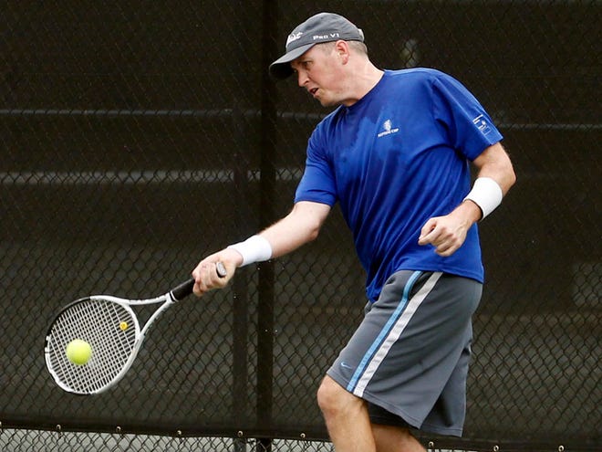 Rick Thomason plays a match against Zachary Wolfe in the 3.5 singles championship of the Neptune Cup at NorthRiver Yacht Club on Saturday. For complete results, see Page 2C.