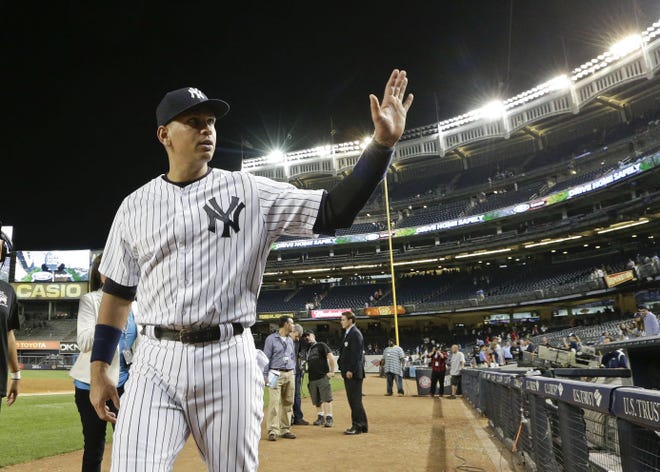 The Yankees' Alex Rodriguez waves to fans as he leaves the field after the Yankees' baseball game against the Detroit Tigers on Friday in New York. Rodriguez hit his 3,000th career hit as the Yankees won 7-2.