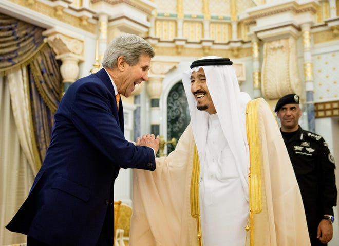 FILE - In this May 7, 2015 file photo, U.S. Secretary of State John Kerry, left, shakes hands with Saudi Arabia's King Salman at the Royal Court, in Riyadh, Saudi Arabia. WikiLeaks is in the process of publishing more than 500,000 Saudi diplomatic documents to the Internet, the transparency website said Friday, June 19, 2015. If genuine, the documents would offer a rare glimpse into the inner workings of the notoriously opaque kingdom. (Andrew Harnik/Pool Photo via AP, File)