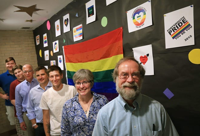 Seacoast Outright, the Portsmouth-based, volunteer-run social support and advocacy organization for gay, lesbian, bisexual, transgendered and questioning young people, will hold the first Portsmouth Pride parade on Saturday, June 27. Pictured by a display in the Portsmouth High School lobby from front to back, Chuck Rhoades, Ellen Gagnon, JD Dorr, Doug Palardy, Dan Innis, Christine Stillwell, and Alden Caple. Photo by Ioanna Raptis/Seacoastonline