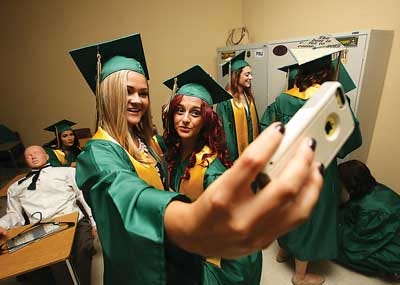 Photos by Daniel Freel/New Jersey Herald Sussex Tech graduating seniors Lauren Ruggiero, left, and Emily Kuczkuda take a selfie together as they wait in a classroom prior to their commencement ceremony Friday.
