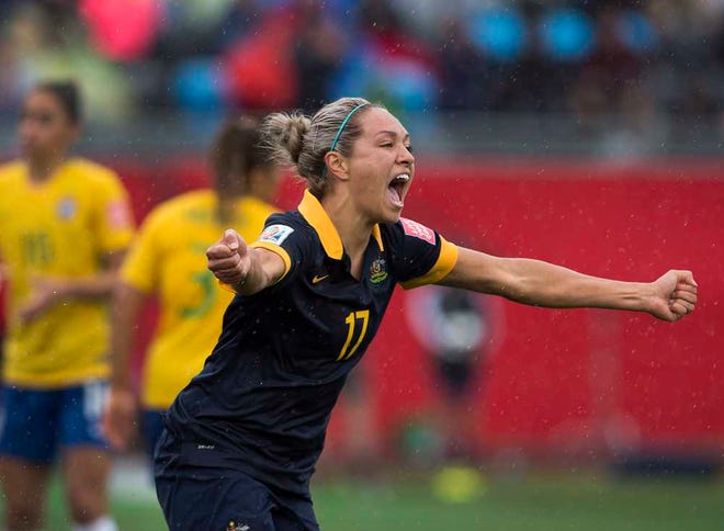 Australia's Kyah Simon celebrates after scoring against Brazil during second-half FIFA Women's World Cup soccer game action in Moncton, New Brunswick, Canada, Sunday, June 21, 2015. (Andrew Vaughan/The Canadian Press via AP) MANDATORY CREDIT