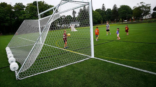 Legion Field has reopened in Weymouth. Peter Cillivan of East Weymouth plays soccer there Sunday, June 21, 2015, with his four kids, PJ, 11, Josh, 9, Maggie, 7, and Amanda, 5.