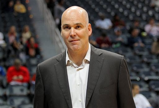FILE - In this Dec. 15, 2012, file photo, Atlanta Hawks General Manager Danny Ferry watches before an NBA basketball game against the Golden State Warriors in Atlanta. The Hawks have announced Monday, June 22, 2015, that Ferry has stepped down as general manager of the team, ending an indefinite leave of absence that began in August following racially derogatory comments Ferry made. (AP Photo/Todd Kirkland, File)