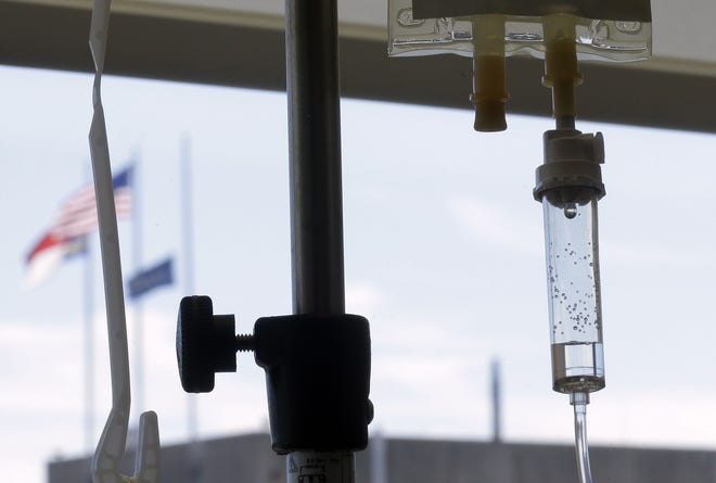 Chemotherapy is administered to a cancer patient via intravenous drip at a hospital in Durham, N.C. on Sept. 5, 2013. AP Photo/Gerry Broome, File