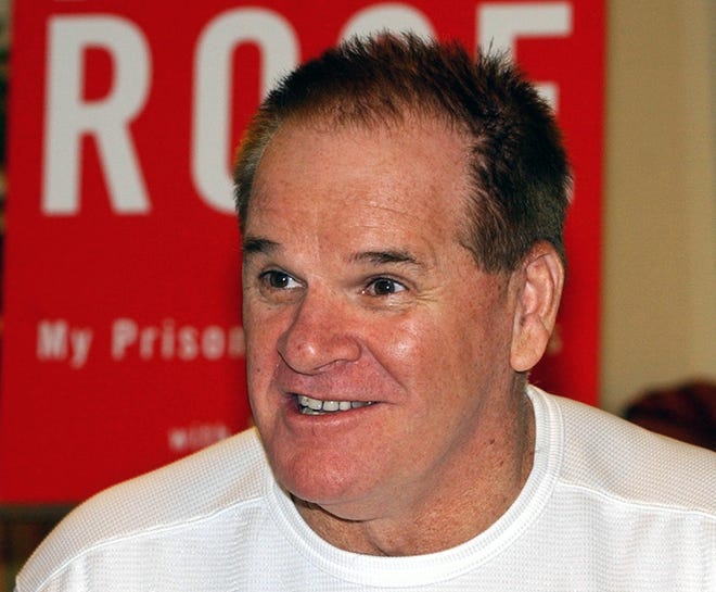 Pete Rose speaks with a buyer of his newest autobiography, "My Prison Without Bars, " at a book-signing on the first day of release in Ridgewood, N.J., in January 2004.