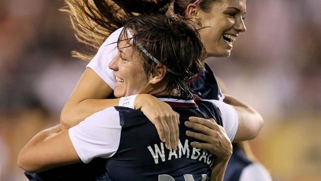 Abby Wambach and Alex Morgan are two U.S. Women’s National Soccer Team stars who have inspired millions of young women to play organized youth soccer. (Allen Eyestone/The Palm Beach Post)