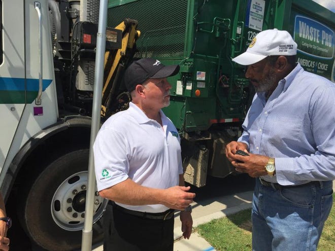 (Diane Turbyfill / The Gazette) Robert Allen (left) and Michael Meeks Sr. talk about a new program called Waste Pro-Tection that's coming to Bessemer City. Meeks heads up the city's neighborhood watch program, and Allen helped develop the new plan that encourages garbage collectors to report suspicious activity to police.
