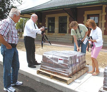From left, Chuck Baber, Mike Mort, Joan Franks and LeeAnn McConnell were on-hand when engraved Depot bricks arrived recently. The bricks have since been installed.