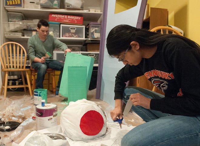 FILE PHOTO Pennsbury High School Odyssey of the Mind team members Sonali Kakarlapudi, right, a freshman, and Max Weissberger, also a freshman, work on props for their skit for a competition in February. The group is "solving" a problem about Pandora's Box, which has a video-game twist, as well as a twist featuring being environmentally friendly.