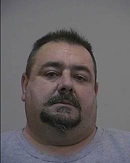 John Chmielinski in a February 2015 mug shot. The Trenton home-improvement contractor was wanted in Bucks County for allegedly ripping off at least four homeowners by accepting payment but doing no work