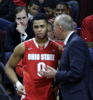 Sixers general manager Sam Hinkie (back left) looks on as Ohio State head coach Thad Matta talks to guard D'Angelo Russell (0) during a Feb. 8 game at Rutgers.