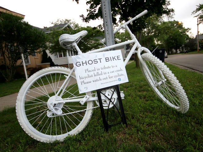 A ghost bike placed at the corner of West 18th Street and River Avenue serves as a silent reminder to honor the memory of Rojelio "Roy" Beltran who was killed at this intersection on May 2, 2015. Rob Wetterholt Jr./Sentinel Staff