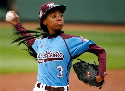 In this Aug. 15, 2014, file photo, Pennsylvania's Mo'ne Davis throws a pitch in the fifth inning against Tennessee during a baseball game in United States pool play at the Little League World Series tournament in South Williamsport, Pa. Former Atlanta Braves slugger Hank Aaron met with the Little League sensation and her Anderson Monarchs teammates, a Philadelphia youth baseball club, on Tuesday, June 23, 2015, who got a tour of Turner Field. (AP Photo/Gene J. Puskar, File)