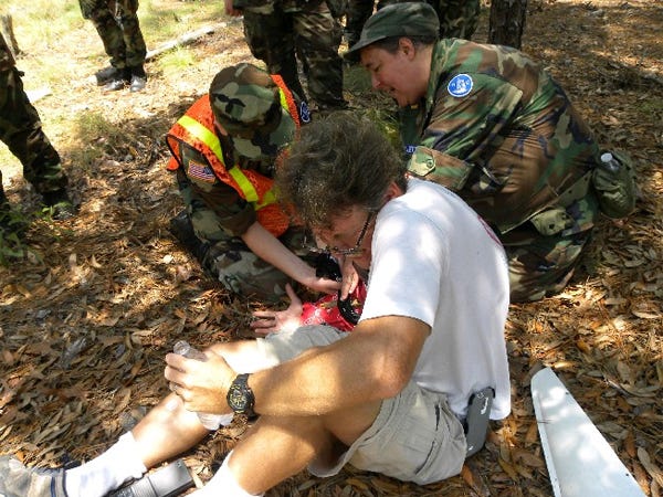 Civil Air Patrol ground team members treat an ìinjured pilotî during a search-and-rescue operation on June 20. Contributed photo