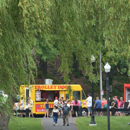 The trees in Elm Park frame vendors at the Worcester Food Truck Festival. T&G File Photo/Chris Christo