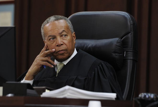 Criminal Court Judge Monte Watkins listens to a witness during a hearing in a case involving two former Vanderbilt football players in court Monday, June 15, 2015, in Nashville, Tenn. Defense attorneys for the two former Vanderbilt football players convicted in the dorm-room rape of a student asked a judge Monday to declare a mistrial, saying a juror intentionally withheld information that he was a rape victim during the jury selection process. (Shelley Mays/The Tennessean via AP)