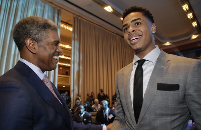 Draft prospect D'Angelo Russell of Ohio State (right) chats with Knicks general manger Steve Mills before the May 19 NBA Draft Lottery in New York.