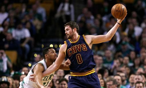 FILE - In this April 23, 2105, file photo, Cleveland Cavaliers forward Kevin Love (0) looks to pass during the first quarter of a first-round NBA playoff basketball game in Boston. Love has watched the Cavaliers reach the finals without him, and with his future uncertain because of free agency, the power forward must soon decide whether to stay in Cleveland or start over elsewhere. (AP Photo/Charles Krupa, File