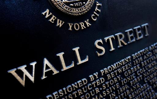 FILE - This Jan. 4, 2010 file photo shows an historic marker on Wall Street in New York. U.S. stocks are opening slightly higher Tuesday, June 23, 2015, as hopes mount for a solution to Greece's debt standoff. (AP Photo/Mark Lennihan, File)