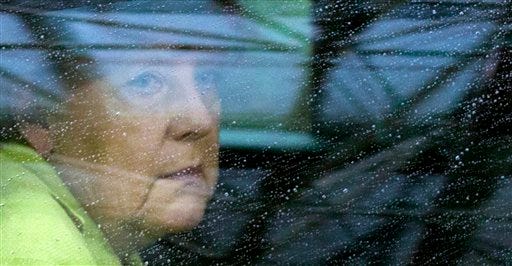 German Chancellor Angela Merkel arrives for an EU summit at the European Council building in Brussels on Monday, June 22, 2015. Heads of state in the eurogroup meet in Brussels Monday for a special summit to discuss the financial crisis with Greece. (AP Photo/Michel Euler)