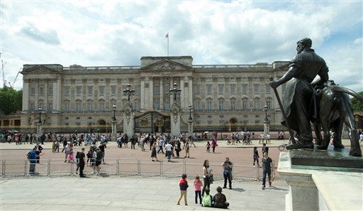 Britain's Queen Elizabeth II's official London residence Buckingham Palace which tourists flock to in London, Wednesday, June 24, 2015. Queen Elizabeth II may have to move out of Buckingham Palace during much-needed renovations to the residence, which has not been substantially redecorated since she took the throne, royal officials said Wednesday, they say the palace needs an estimated 150 million pounds ($237 million) of renovation and upgrades, including replacing old plumbing and wiring and removing asbestos.