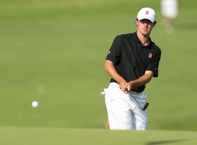 Stanford's Cameron Wilson chips onto the 15th green during the semi-finals of team match play of the NCAA national championship Tuesday, May 27, 2014 at Prairie Dunes Country Club in Hutchinson, Kan. Wilson defeated Oklahoma State's Ian Davis 4 & 2. (AP Photo/The Hutchinson News, Travis Morisse)