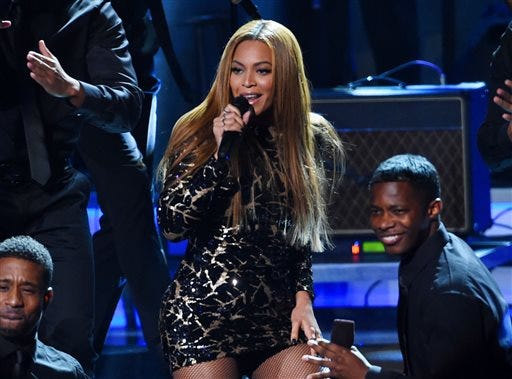 In this Feb. 10, 2015 file photo, Beyonce performs at "Stevie Wonder: Songs in the Key of Life - An All-Star Grammy Salute," at the Nokia Theatre L.A. Live in Los Angeles. The Weeknd and pop diva Beyonce will headline the Budweiser Made in America festival over Labor Day weekend in Philadelphia, it was announced Wednesday, June 24. Jay Z?s two-day festival on Sept. 5 and 6 across Philadelphia?s Benjamin Franklin Parkway will also include Axwell & Ingrosso, J. Cole, Bassnectar, Modest Mouse, Big Sean, Death Cab for Cutie and Meek Mill. Tickets go on sale Monday. (Photo by Chris Pizzello/Invision/AP, File)