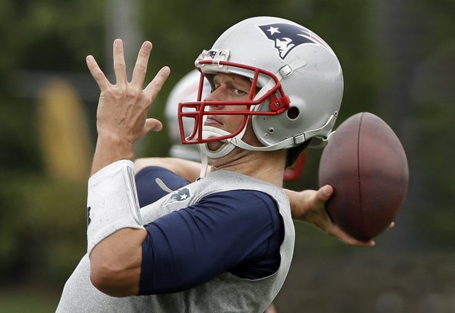 In this June 16, 2105, file photo, New England Patriots quarterback Tom Brady throws a pass during an NFL football minicamp in Foxborough, Mass. Brady grew from a sixth-round draft choice into one of the best quarterbacks in NFL history. On Tuesday, NFL commissioner Roger Goodell hears Brady's appeal of a four-game suspension for using deflated footballs in the AFC championship game. How will that affect Brady's legacy?