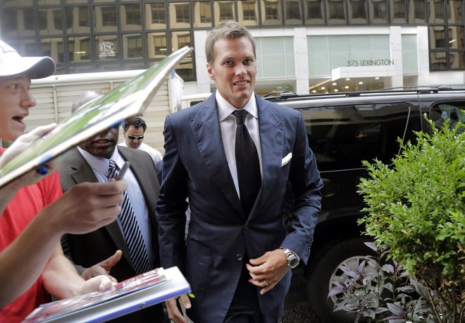 Tom Brady arrives for his appeal hearing at NFL headquarters in New York on Tuesday. It is unknown if Brady's appeal was successful in reducing his four-game suspension for next season. AP FILE PHOTO
