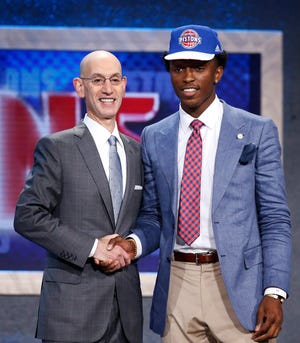 Stanley Johnson, right, poses for photos with NBA Commissioner Adam Silver after being selected eighth overall by the Detroit Pistons during the NBA basketball draft, Thursday, June 25, 2015, in New York. (AP Photo/Kathy Willens)